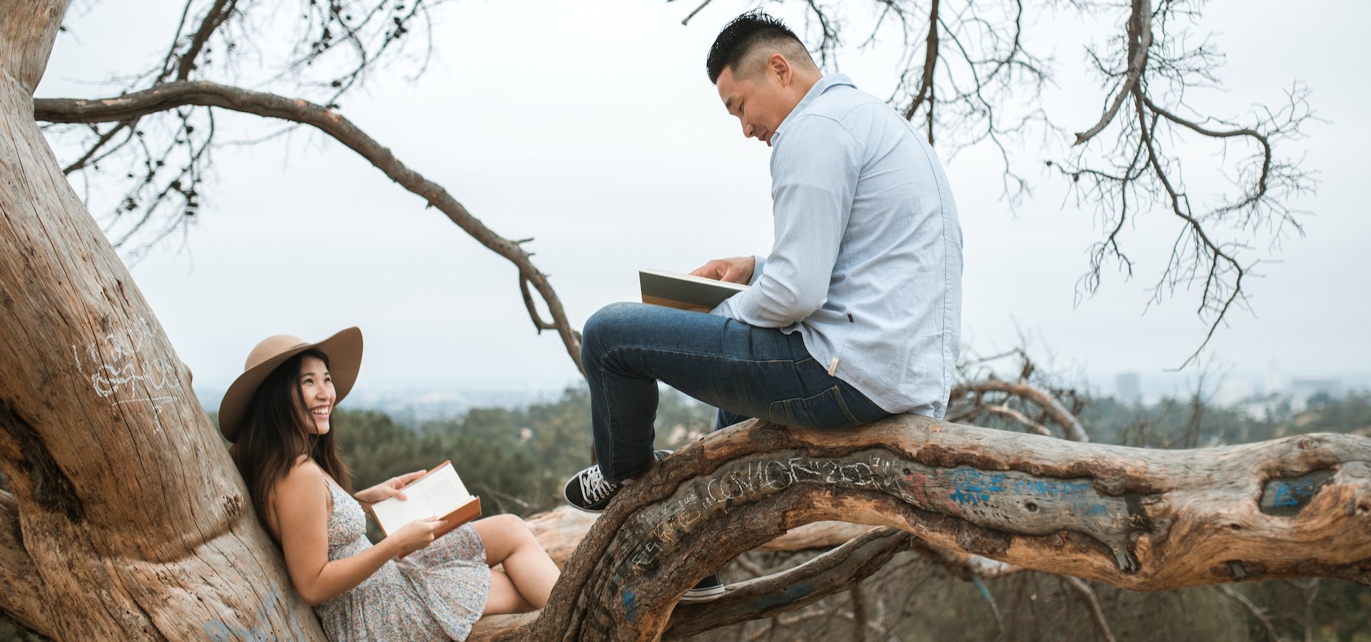 Couple reads about informed consent together in nature.